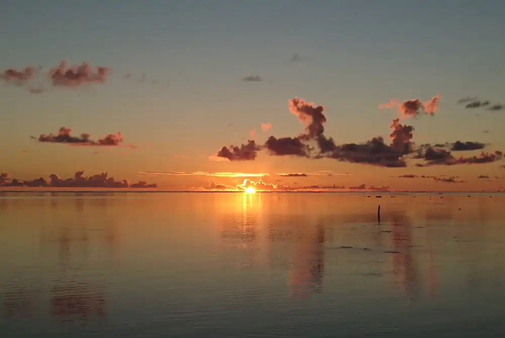 amazing sunset on moorea lagoon in french polynesia