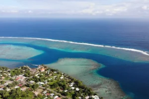 High view over the turquoise lagoon, reef and coastline from the heights of Magic Mountain