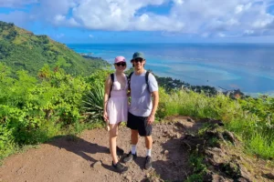 Couple on the summit trail of Magic Mountain with Moorea’s lagoon in the background